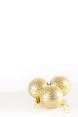 Golden Christmas balls isolated on a white background
