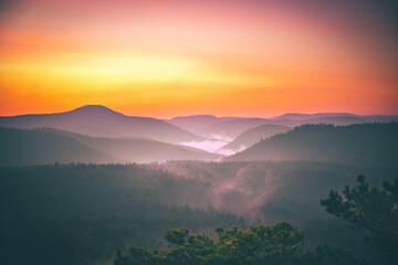 Beautiful landscape in the mountains, great views of nature. Sunset, forest trees, meadow bushes. Nice distant horizon and plantings. unique atmosphere with great clouds