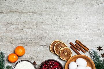 Christmas baking ingredients on light marble table top view. copy space for your design. Christmas menu template.