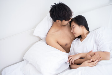 Obraz na płótnie Canvas Couple Asian man and woman on bed