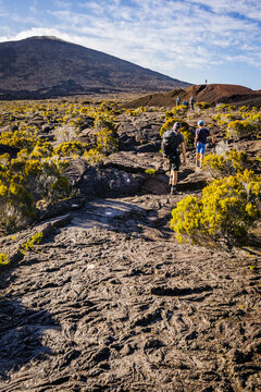 Hikers walking to the summit of the Piton de la Fournaise volcano in Réunion