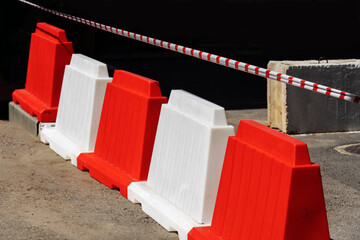 Plastic road barriers. Construction work on the road section. No people