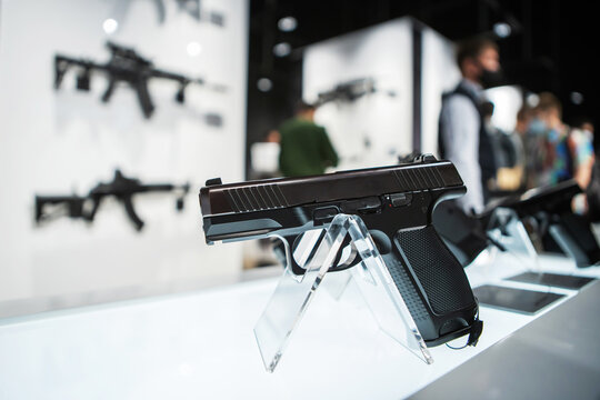 A pistol on the counter of a gun shop. Firearms trade.