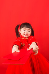 A Chinese girl celebrates Chinese New Year with a red envelope