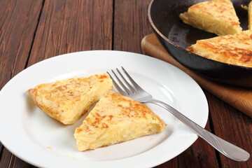 Piece of Spanish omelette on plate