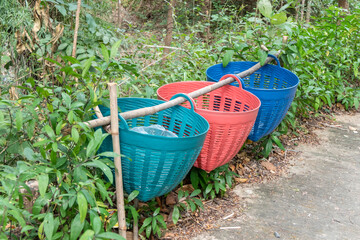 The colorful trash in the park lined up.
