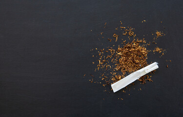 no smoking concept, cigarette on black wood table background. top view. flay lay