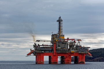 Deep water drill rig is moored near shore after finishing an exploration well, Newfoundland and...