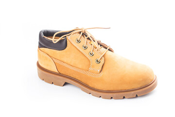 Yellow nubuck leather men's boots on white background