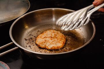 Frying the burgers in the turkey breast burger pan