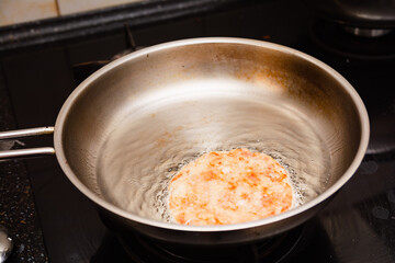 Frying the burgers in the turkey breast burger pan