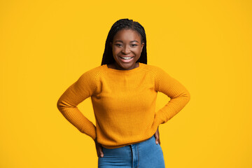 Cheerful Lady. Portrait Of Happy Smiling African American Female Over Yellow Background