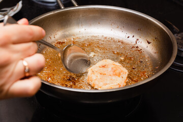 Frying the burgers in the turkey breast burger pan
