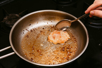 Frying the burgers in the turkey breast burger pan