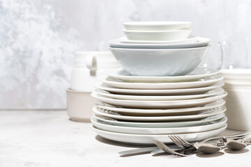 empty tableware and cutlery on a white background