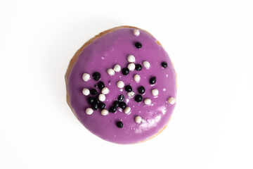 A bun covered with glaze on a white background. Isolate. View from above.