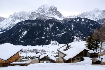 Mountain view with Sexten /Sesto village in winter scenery. Dolomites, Italy, Puster Valley / Alta Pusteria, South Tyrol.