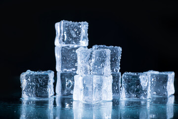 ice cubes and crushed ice on a black background