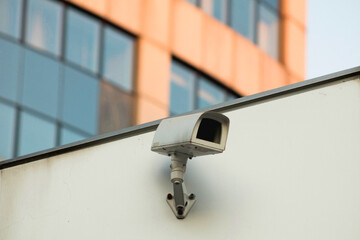 Security camera on the wall of the building.