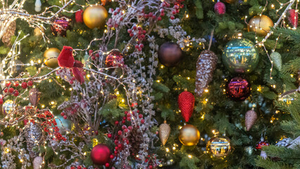 Obraz na płótnie Canvas A lot of christmas toys in the form of birds. Decorated christmas tree background. Happy new year concept.