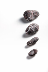 Composition of pebbles on a white background