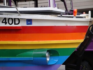 Fototapeta na wymiar rainbow boat on the river