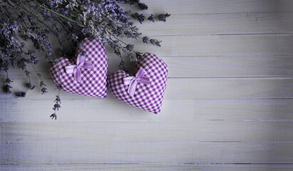 beautiful hearts with a bouquet of lavender on a wooden background