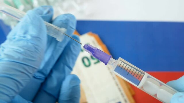 russian flag, vaccine sputnik-V or EpiVacCorona and money, money for purchase and production vaccine concept