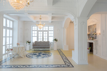 beautiful stylish chic rich clean bright blank interior. high white walls with large windows from floor the pattern on the floor