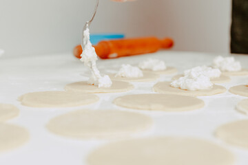 The process of making cookies. A man cooks in the kitchen. Modern lifestyle in home.