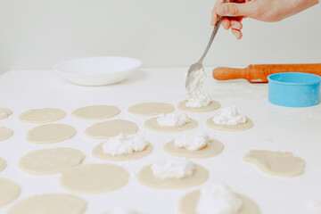 The process of making cookies. A man cooks in the kitchen. Modern lifestyle in home.