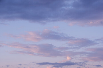 Soft pink clouds in sunset sky