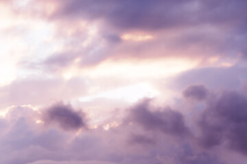 Soft pink clouds in sunset sky