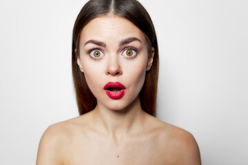 Surprised woman with red lips open mouth nude shoulders 