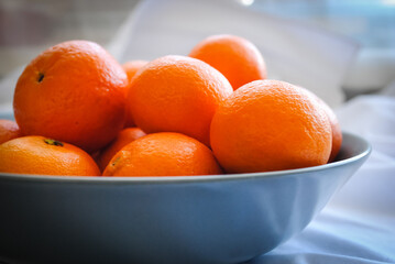 Ripe clementine tangerines close-up on the table.