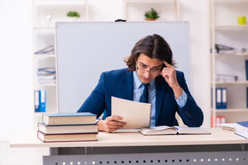 Young businessman student studying at workplace