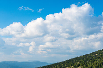 Blue sky and clouds over the rocks, beautiful cloud landscape over mountain range