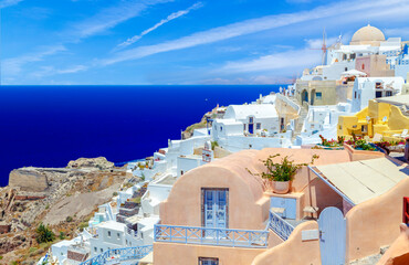 Beautiful panoramic landscape of Santorini island, Oia luxury resort and blue sea sea view with white architecture. Famous travel destination, amazing scenery with pools and luxurious Europe tourism.