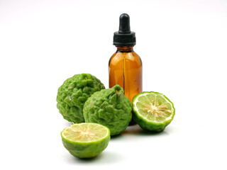 Bergamot essential oil and fruit, isolated on white background