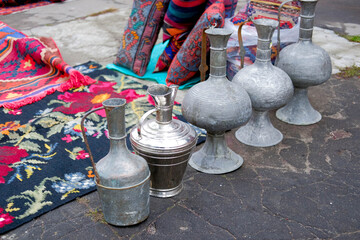 Oriental motifs with jugs and carpet.