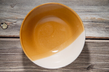 top view of shining yellow moon dish on light brown wooden table stock photo