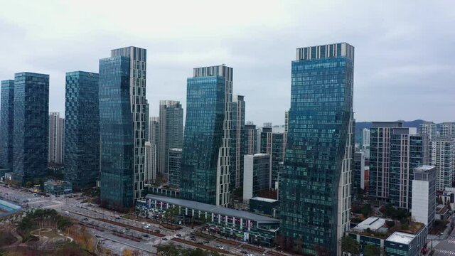 View of apartment complex near Songdo Central Park, Korea, drone shot. Cloudy day.