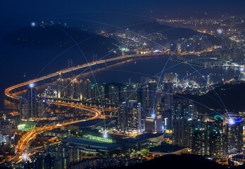 Fototapeta na wymiar Smart city and connection lines. Cityscape of Busan, South Korea, at night. Technology, network connection, information and smart city concept.