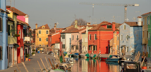 Fototapeta na wymiar Brightly painted canalside houses in Burano