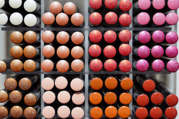 Colorful lipstick crayons on a shelf