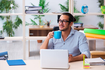 Young male employee working in the office