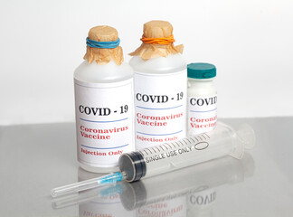 Coronavirus Vaccine injection vials medicine drug bottles Covid-19 with syringe