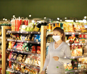 supermarket shopping, face mask,Woman choosing a dairy products at supermarket.