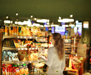 supermarket shopping, face mask,Woman choosing a dairy products at supermarket.