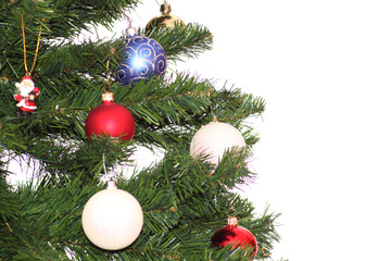 Naklejka na ściany i meble Christmas and New Year tree decorated with festive balls on a white background.